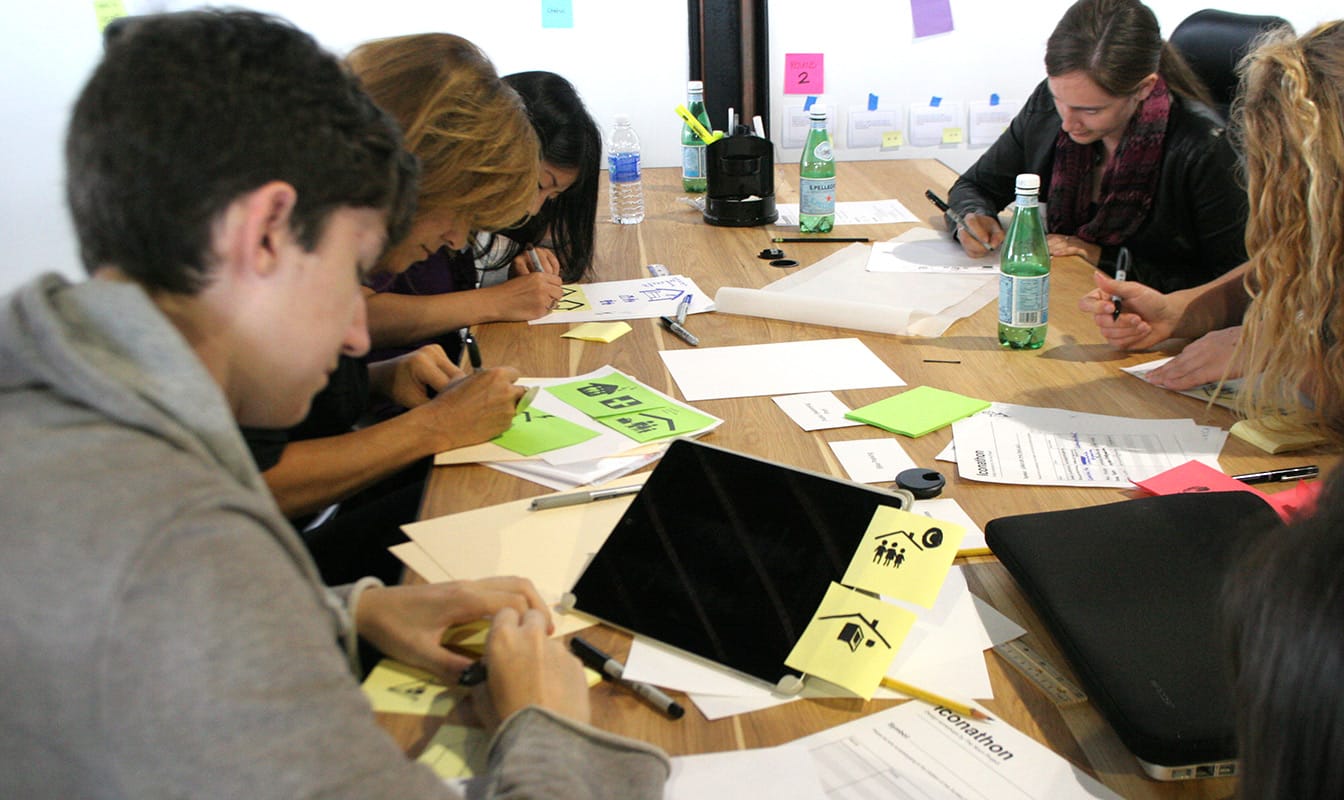 Local job seekers engage in a card-sorting activity with Code for America field workers