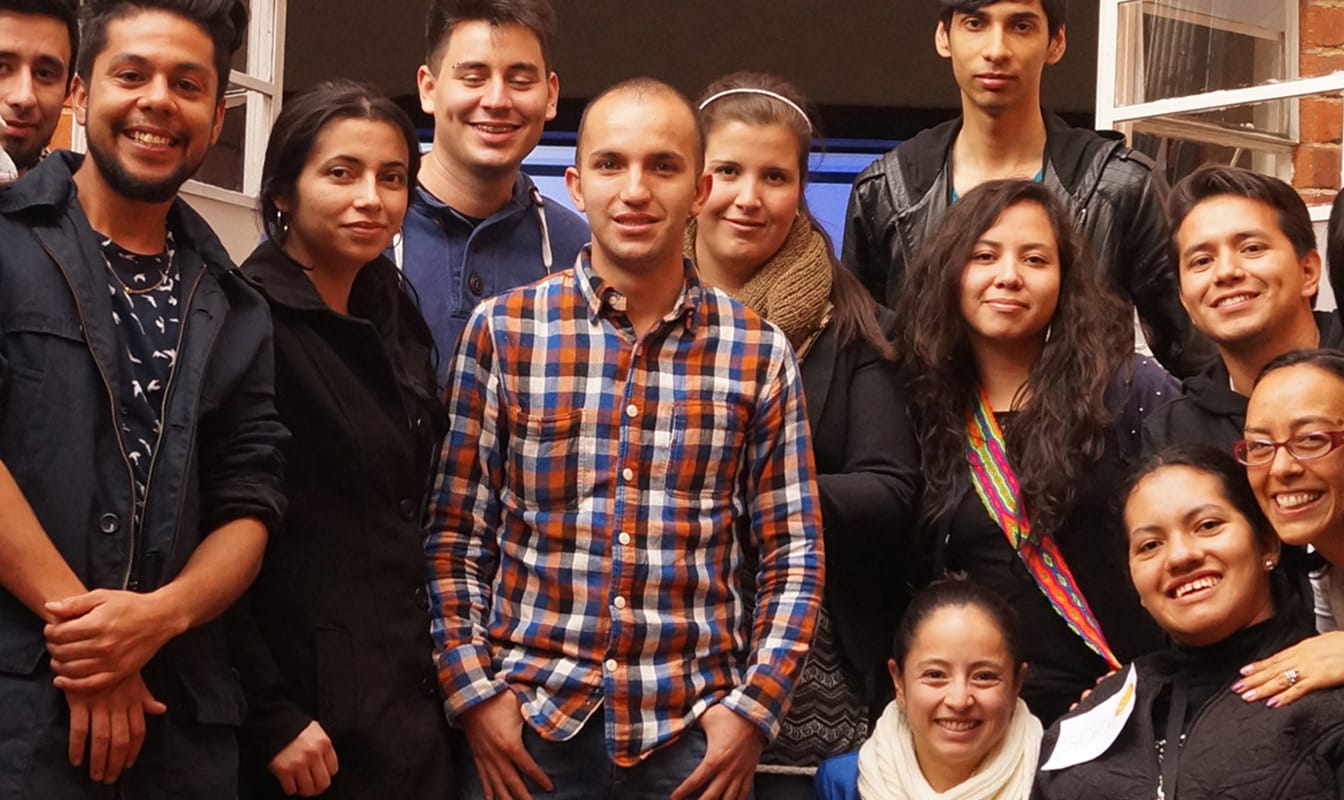 A Google volunteer poses with Colombian youth after a training session.