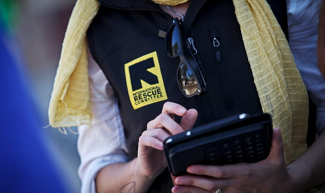 An IRC field worker accesses Refugee.Info from a tablet.