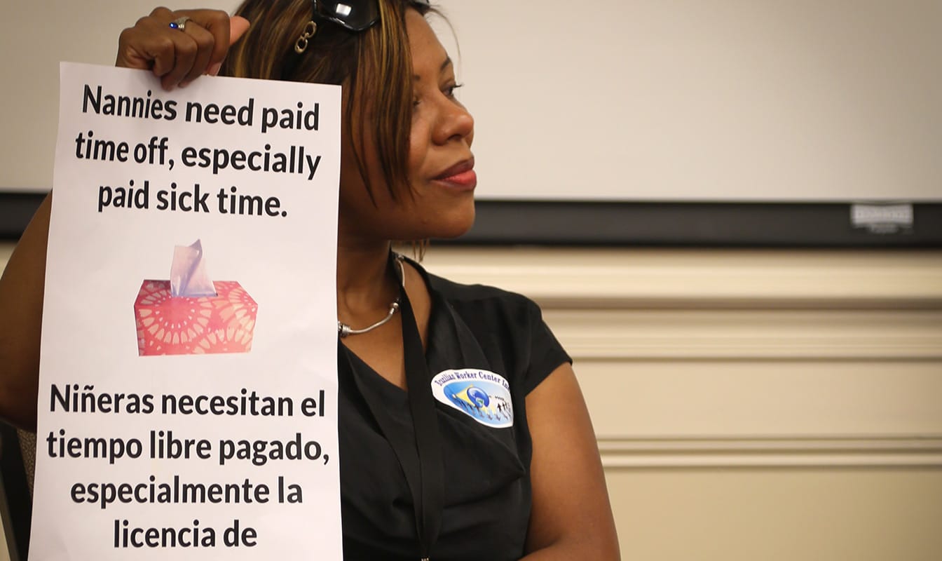 An NDWA member advocates for labor protections for domestic workers
